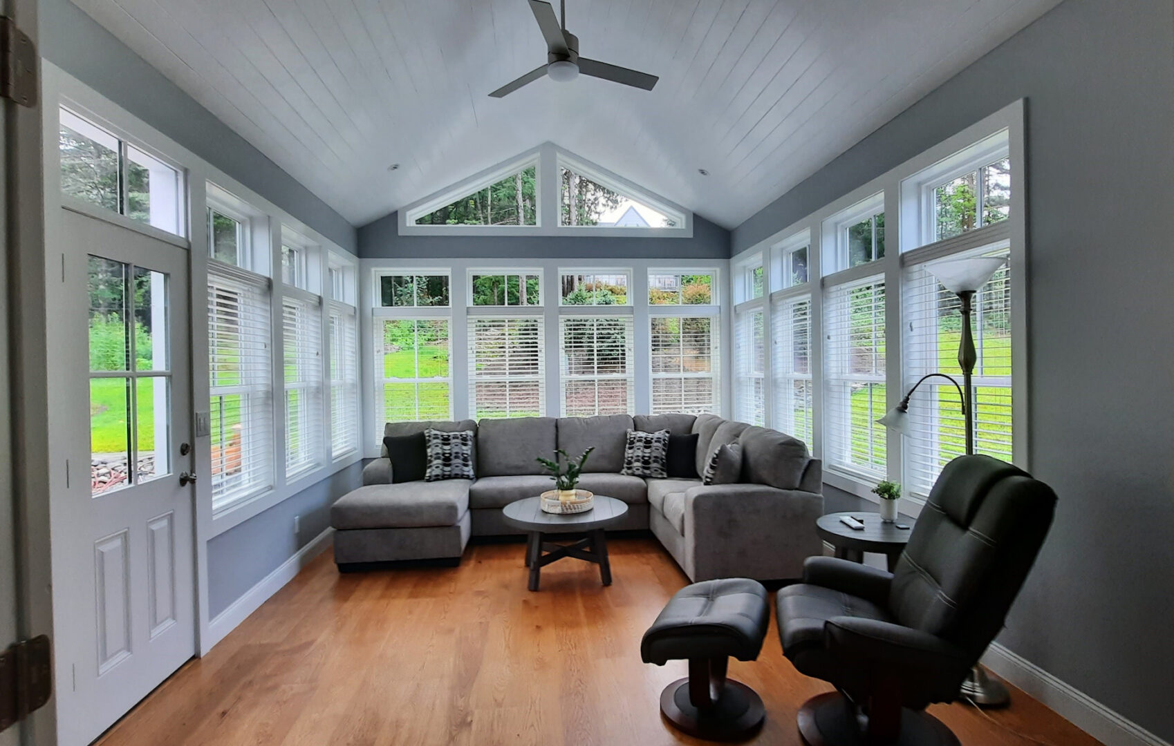 A picture of a living room with black and gray